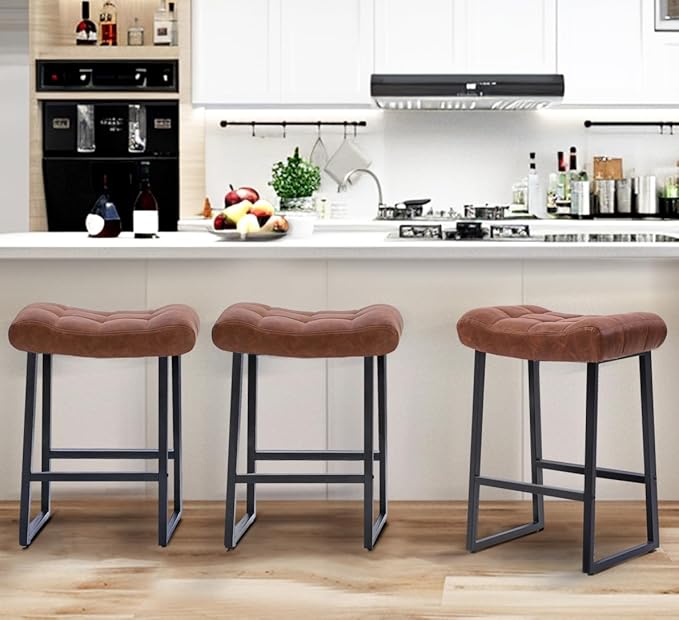 Modern Bar Stools Set of 3 for Kitchen Counter 24 inch Counter Height Backless Barstools with Upholstered Faux Leather Saddle Seat and Metal Frame Industrial Bar Chairs, Brown